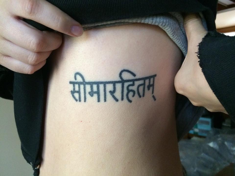 'Limitless' tattoo in Sanskrit